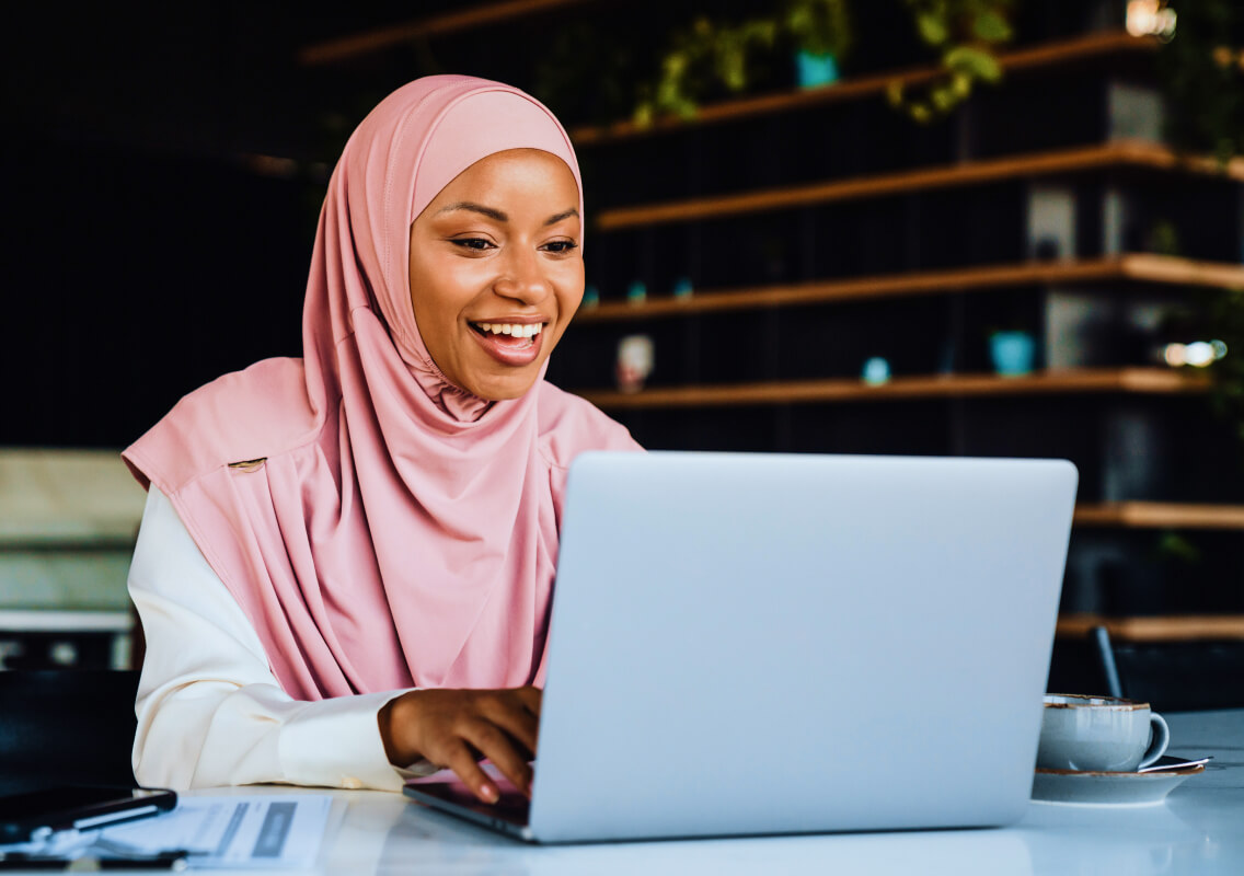 woman-laptop-video-call-in-cafe woman-laptop-video-call-in-cafe